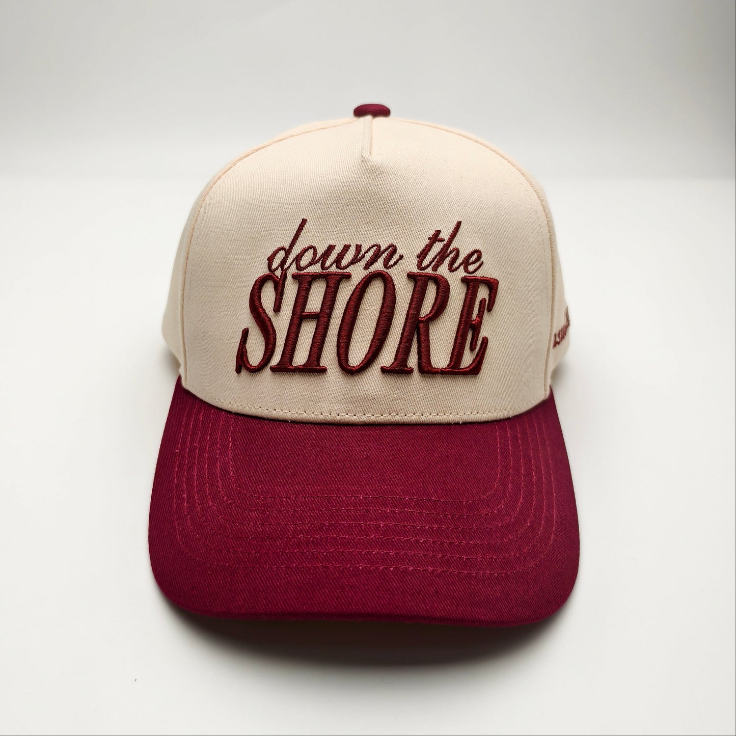 Cap with 'down the Shore' text on a white background