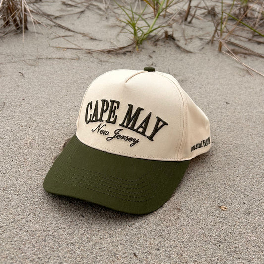 Beige cap with 'Cape May New Jersey' text on a sandy beach
